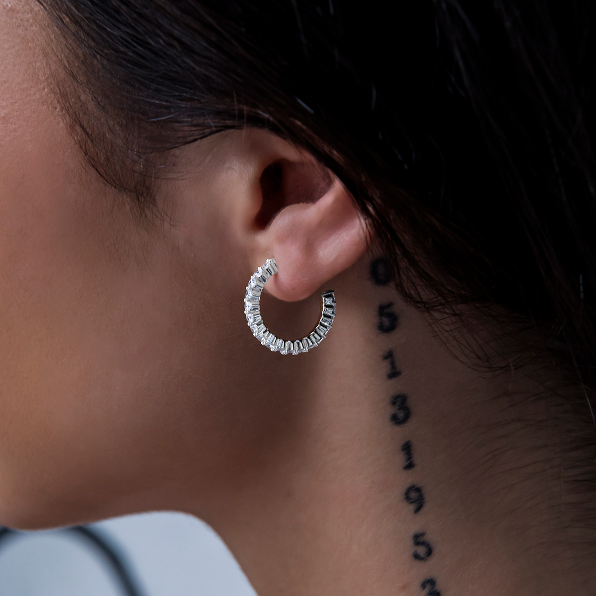 Eternity Huggie Earrings in White Gold